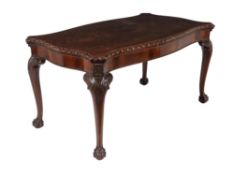 A carved mahogany centre table, in George II style