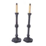 A pair of lacquered and patinated bronze table lamps in Gothic Revival taste