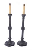 A pair of lacquered and patinated bronze table lamps in Gothic Revival taste