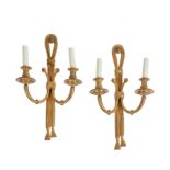 A set of four gilt bronze twin light wall appliques in Louis XVI style