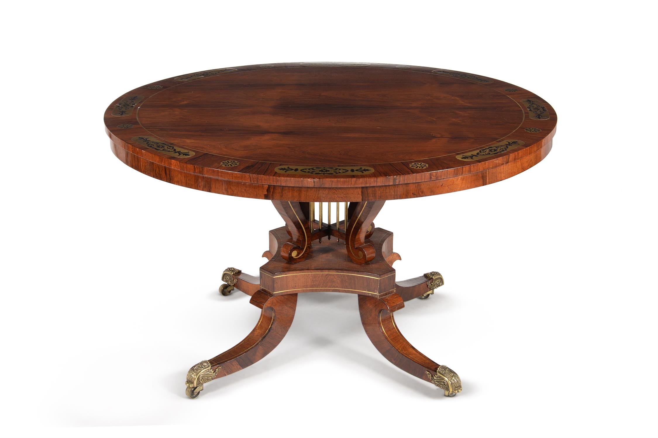 Y Y A Regency rosewood and brass inlaid circular centre table