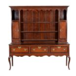 A George III oak and mahogany banded dresser