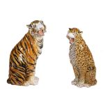 A companion pair of modern red pottery models of big cats