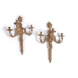 A pair of substantial French gilt composition three light wall appliqués in Louis XVI style