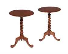 A companion pair of Victorian mahogany tripod occasional tables