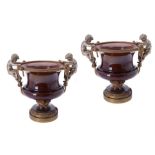 A pair of Continental gilt and silvered metal and pottery mounted jardinières