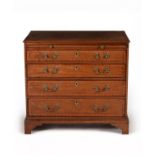 A George III mahogany and satinwood crossbanded chest of drawers
