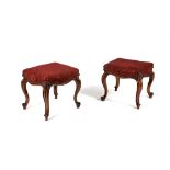 A pair of Victorian walnut and upholstered stools
