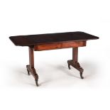 A Regency mahogany and ebonised strung sofa table