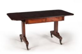 A Regency mahogany and ebonised strung sofa table