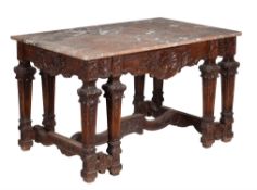 A French carved oak and marble topped centre table