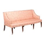A mahogany and upholstered sofa in George III style