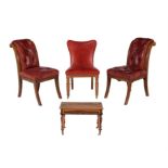 A pair of mahogany and red leather upholstered chairs in Victorian style