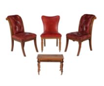 A pair of mahogany and red leather upholstered chairs in Victorian style