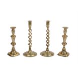 A pair of brass barley twist candlesticks