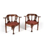 A pair of mahogany corner armchairs in George III style