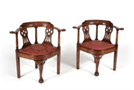 A pair of mahogany corner armchairs in George III style