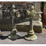 A pair of stone composition exterior light fitments or brackets
