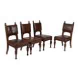 A set of four Renaissance Revival walnut and leather upholstered side chairs