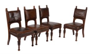 A set of four Renaissance Revival walnut and leather upholstered side chairs