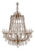 A Continental, probably Bohemian, brass and clear glass mounted eighteen branch chandelier