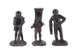 Three Continental, probably French, carved and stained wood models of peasants