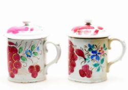 Two near pairs of Russian hand decorated porcelain mugs and covers