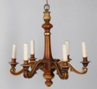 A mahogany and parcel gilt six light chandelier