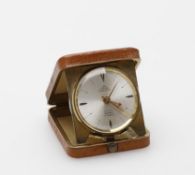 Pontifa, a gilt metal and leather travel alarm clock