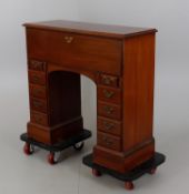 A George II and later "red walnut" kneehole writing desk