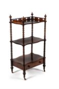 A Victorian three tier rosewood whatnot
