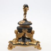 A 19th century French gilt and patinated inkwell