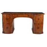 A Regency mahogany and line inlaid serpentine fronted sideboard