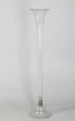 A tall glass floral arrangement vase