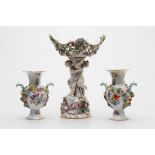 A Meissen flower encrusted figural centrepiece