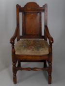 A pair of oak open armchairs