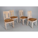 A set of four limed hardwood side chairs