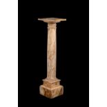 An Italian striated white and amber coloured marble columnar pedestal
