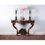 A Louis XV carved oak console table, circa 1735