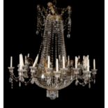 A pair of Continental clear glass and gilt metal mounted twenty-four light chandeliers in early 19th