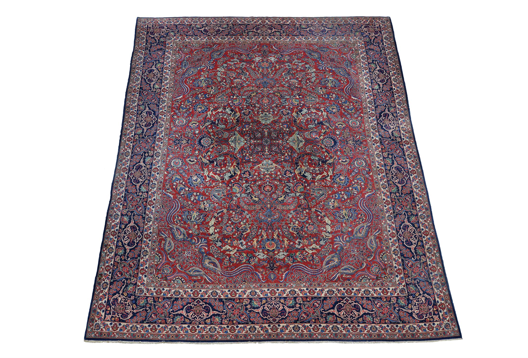 A Kashan carpet, the red field decorated with an overall design
