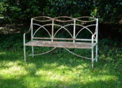 A Regency white painted cast iron garden bench