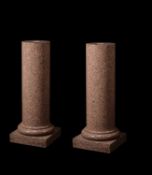 A pair of English or Scottish Peterhead granite columnar pedestals