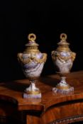 A pair of fine and rare French banded amethyst quartz and ormolu mounted pot pourri urns and covers