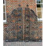 Two pairs of black painted cast and wrought metal gates