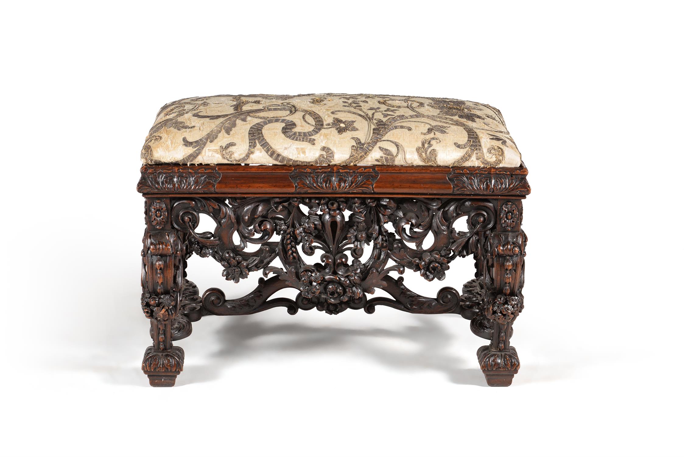A carved walnut stool, in late 17th century style, in the manner of designs by Daniel Marot
