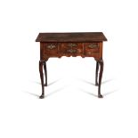 A George II walnut, burr walnut and feather banded side table, circa 1735