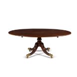 A George III figured mahogany and burr elm banded pedestal dining table