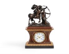 A French parcel gilt and patinated bronze mounted and rouge griotte mantel clock