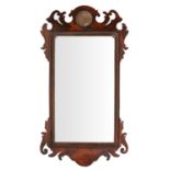 A George II mahogany and parcel gilt wall mirror, circa 1750